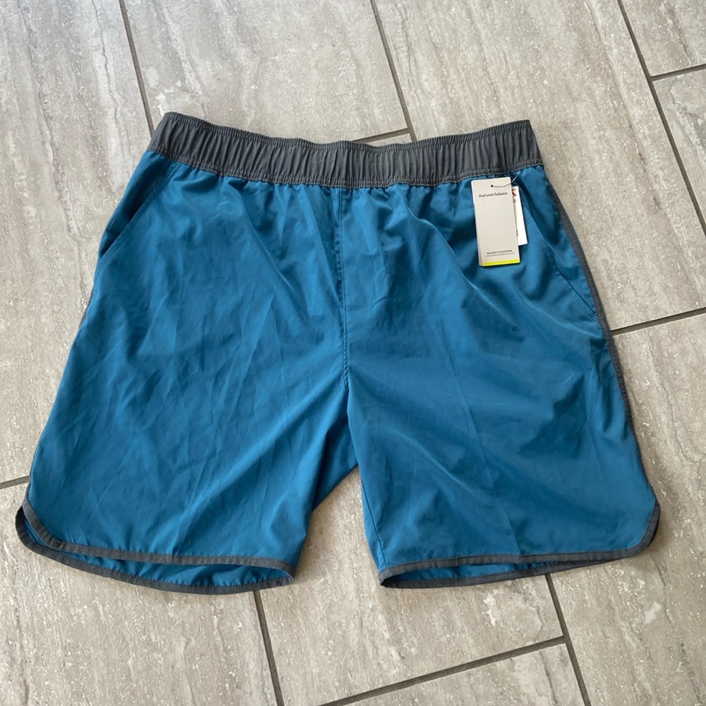 Swim trunks NWT teal blue w gray stripes on side